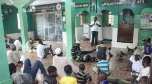 An SSSCF volunteer sensitising worshippers on sickle cell disease at Bariga Central Mosque, Lagos