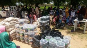 A cross-section of girls graduates of M4D's life skill club, with items to support them pursue the enterpreneurial skills, they acquired during their graduation ceremony in Rimi, Sumaila LGA of Kano state